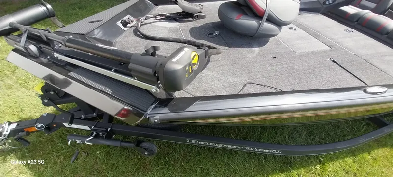 Slide: The Image of 2024 Ranger RT178C boat on grass, featuring a sleek design and modern equipment. - 22