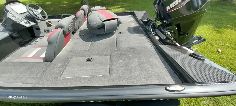 Slide: The Image of 2024 Ranger RT178C boat interior with seats and Mercury outboard motor. - 34