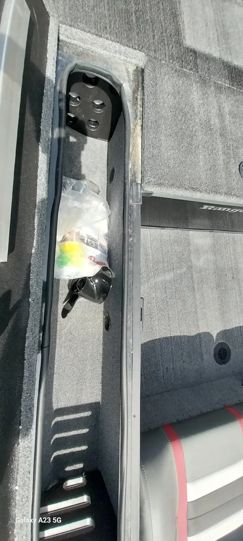 Slide: The Image of 2024 Ranger RT178C boat interior storage compartment with accessories. - 36