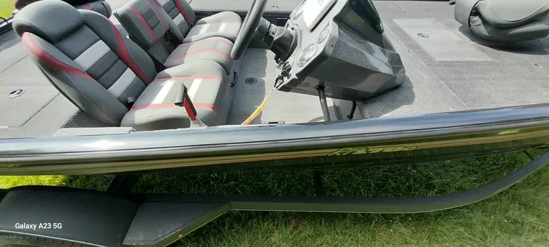 Slide: The Image of 2024 Ranger RT178C boat interior with seating and steering console. - 7