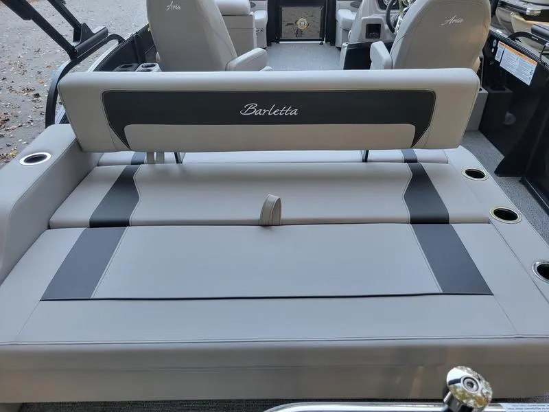 Slide: The Image of 2025 Barletta A20UC boat interior with gray seating and cup holders. - 16