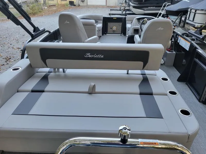 Slide: The Image of 2025 Barletta A20UC pontoon boat interior with gray seating and cup holders. - 17