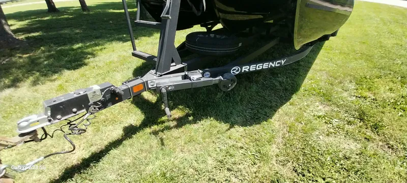 Slide: The Image of Trailer hitch of a 2023 Regency 250 LE3 Sport on grass. - 25