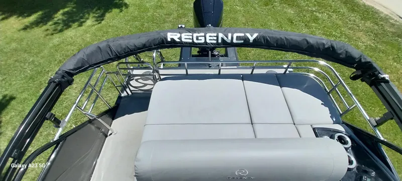 Slide: The Image of 2023 Regency 250 LE3 Sport boat with cushioned seating and canopy, viewed from above. - 36