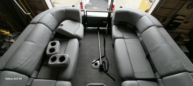 Slide: The Image of Interior of 2023 Regency 250 LE3 Sport boat with gray seating and cup holders. - 4
