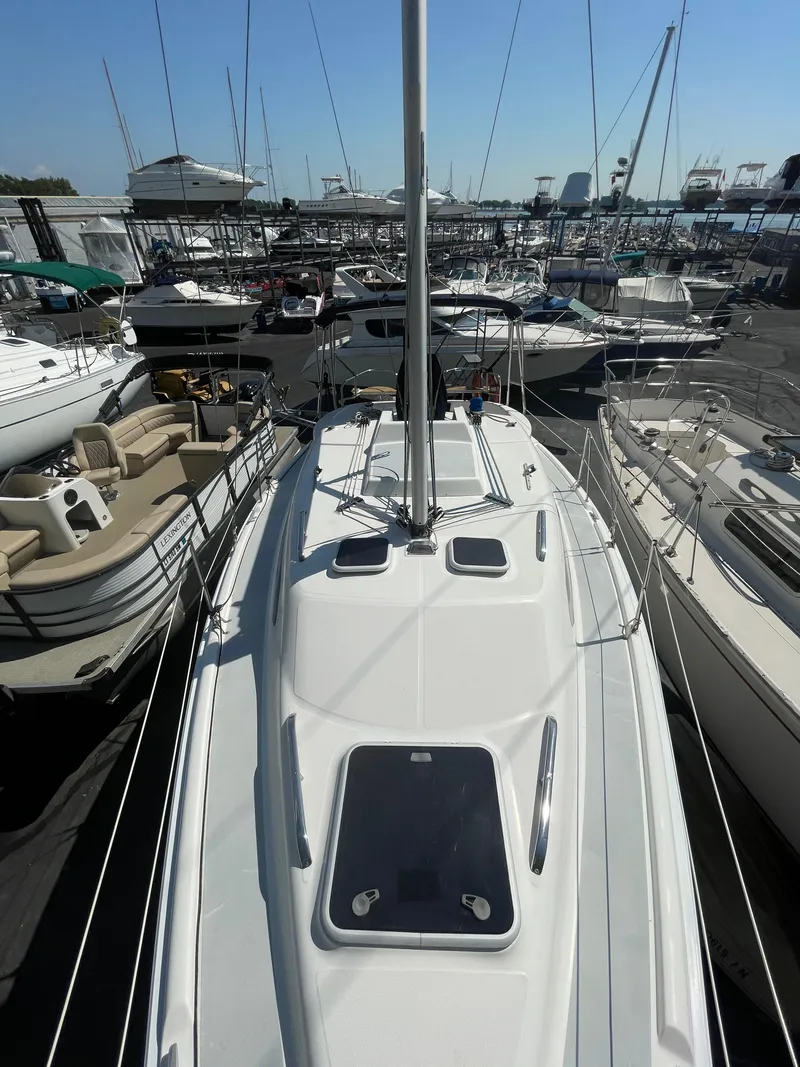 Slide: The Image of Hunter 306 sailboat from 2001 docked among other boats in a marina. - 1