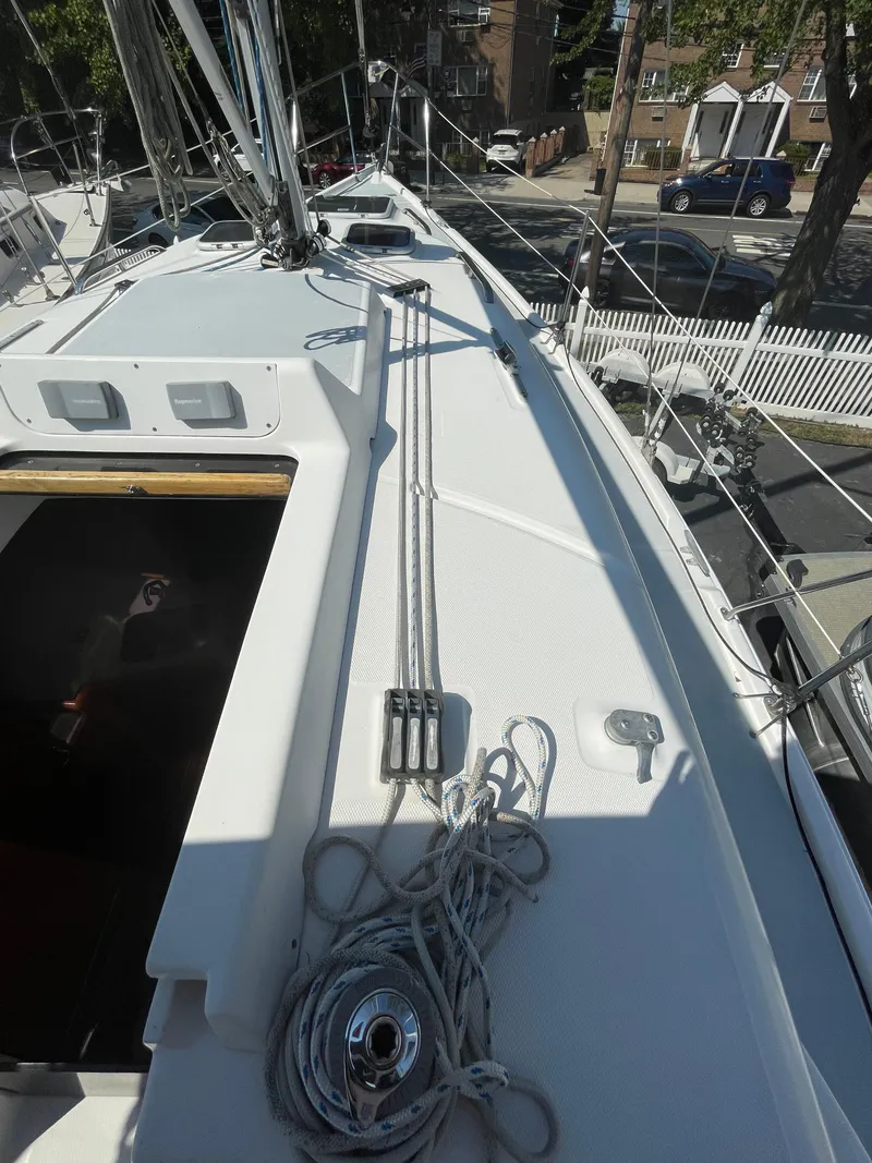 Slide: The Image of Deck of 2001 Hunter 306 sailboat with rigging and ropes. - 6