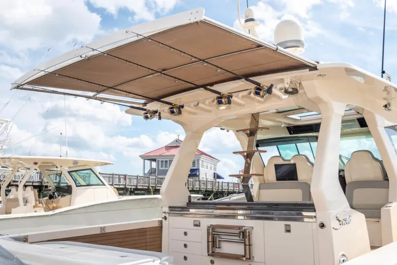 Slide: The Image of Manufacturer Provided Image: 2025 Scout 530 LXF luxury boat with spacious deck and modern amenities. - 13