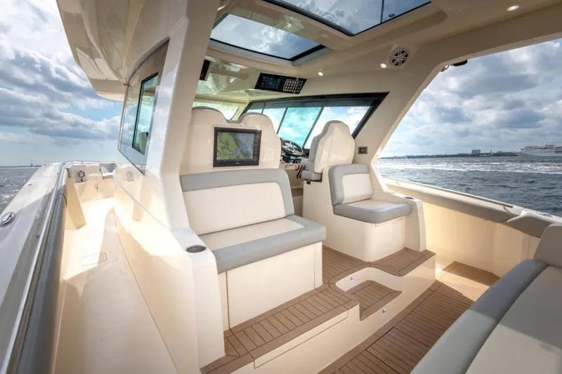 Slide: The Image of Manufacturer Provided Image: 2025 Scout 530 LXF luxury boat interior with seating and ocean view. - 17