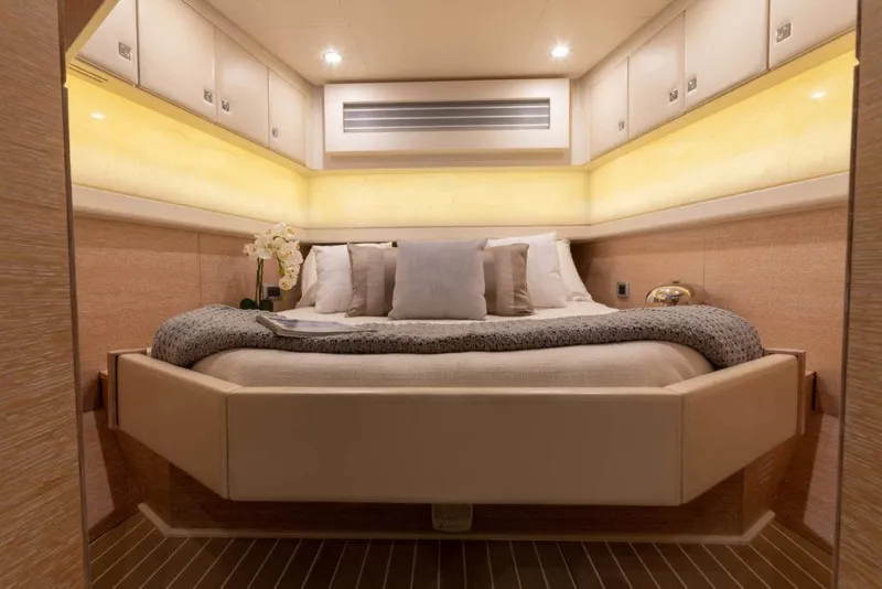 Slide: The Image of Manufacturer Provided Image: Luxurious cabin interior of 2025 Scout 530 LXF yacht with elegant bedding and ambient lighting. - 24