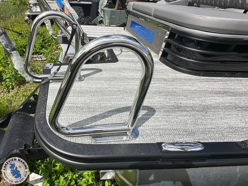 Slide: The Image of 2025 Bennington 23 LXSSB boat deck with stainless steel railings and seating. - 2