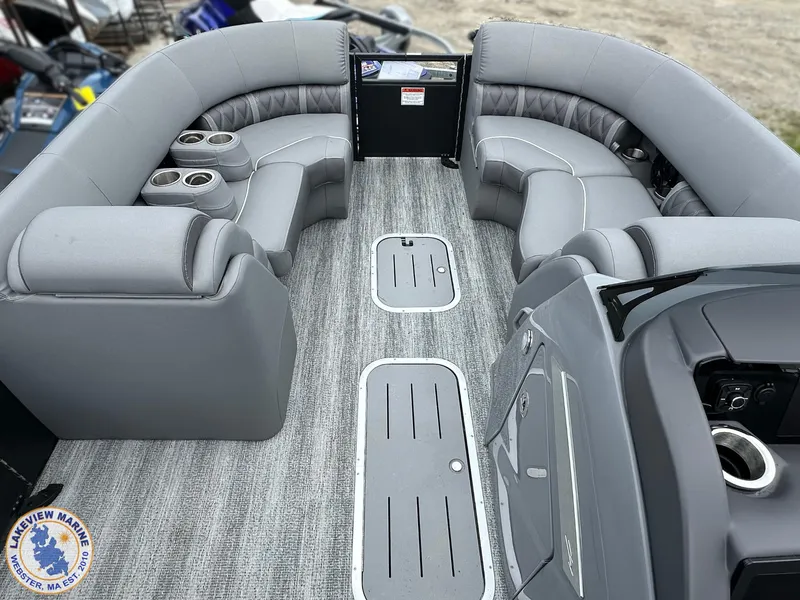 Slide: The Image of 2025 Bennington 23 LXSSB pontoon boat interior with gray seating and cup holders. - 3