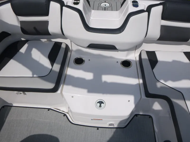 Slide: The Image of 2025 Yamaha AR195 boat interior with sleek seating and cup holders. - 10