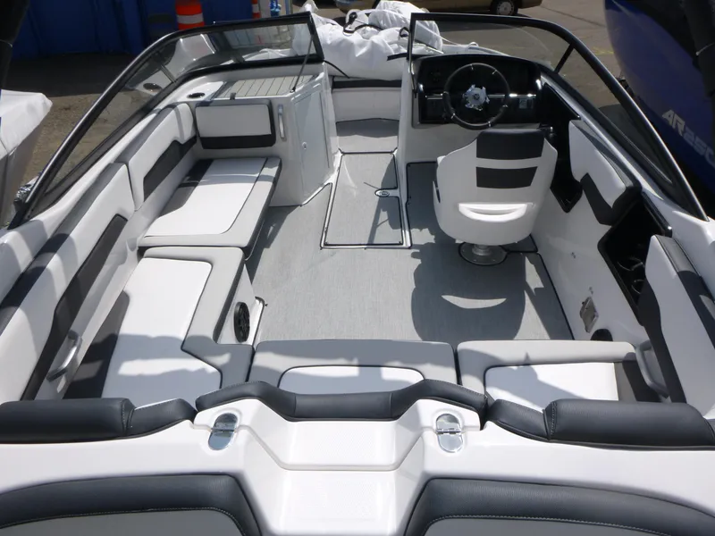 Slide: The Image of 2025 Yamaha AR195 boat interior with sleek seating and modern steering console. - 4