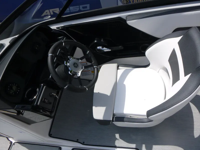 Slide: The Image of 2025 Yamaha AR195 boat cockpit with steering wheel and white seat. - 6