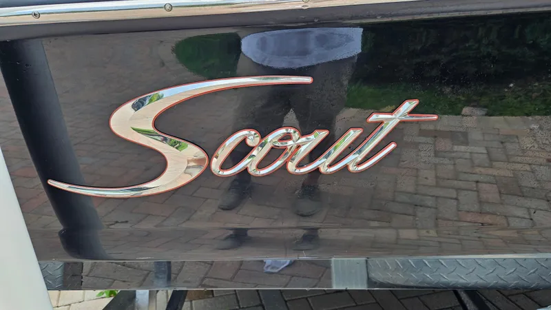 Slide: The Image of 2021 Scout 231 XS logo on a reflective black surface. - 14