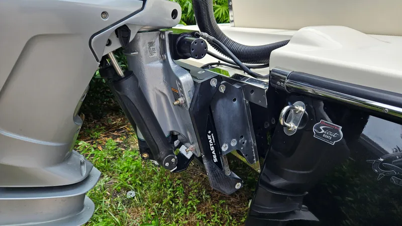 Slide: The Image of 2021 Scout 231 XS boat engine and transom detail with SeaStar hydraulic system. - 19