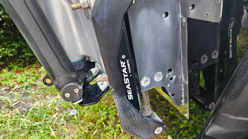 Slide: The Image of Close-up of 2021 Scout 231 XS boat's SeaStar hydraulic steering system. - 21