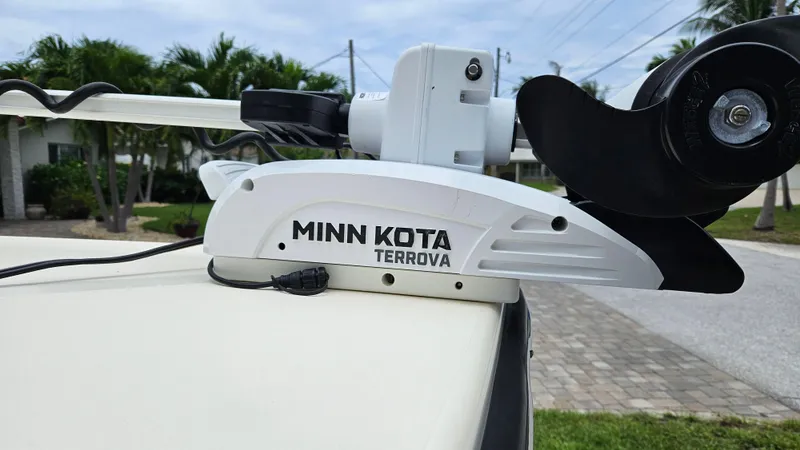 Slide: The Image of Minn Kota Terrova motor on 2021 Scout 231 XS boat, outdoor setting. - 23