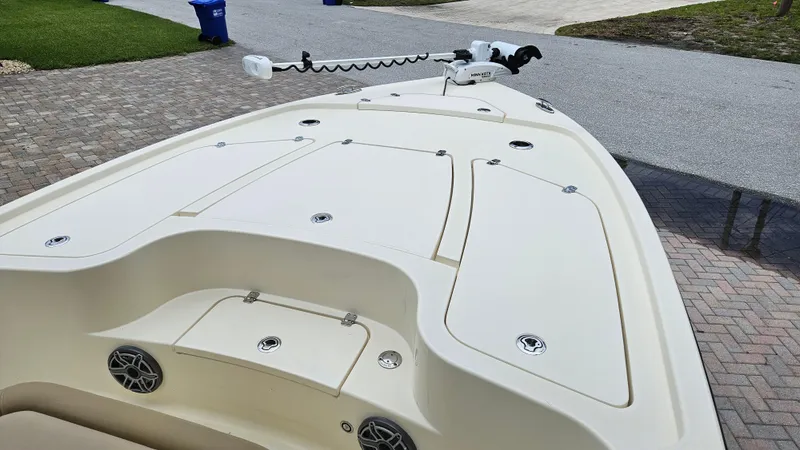 Slide: The Image of 2021 Scout 231 XS boat deck with storage compartments and trolling motor. - 27