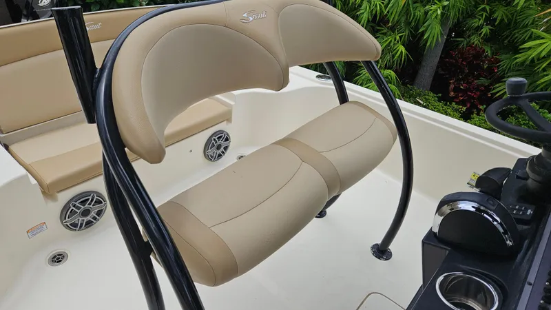 Slide: The Image of 2021 Scout 231 XS boat interior with beige seating and black frame. - 41