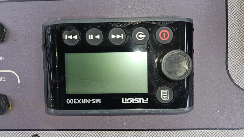 Slide: The Image of Control panel of a Fusion MS-NRX300 on a 2021 Scout 231 XS boat. - 46