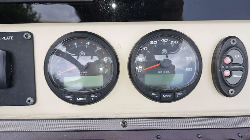 Slide: The Image of Dashboard of a 2021 Scout 231 XS boat with RPM and speed gauges. - 48