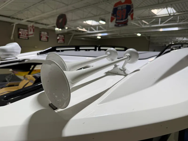 Slide: The Image of 2024 Sunsation 34 CCX boat with dual white air horns on deck. - 18