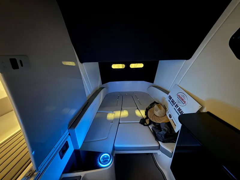 Slide: The Image of 2024 Sunsation 34 CCX cabin interior with ambient lighting and seating area. - 19