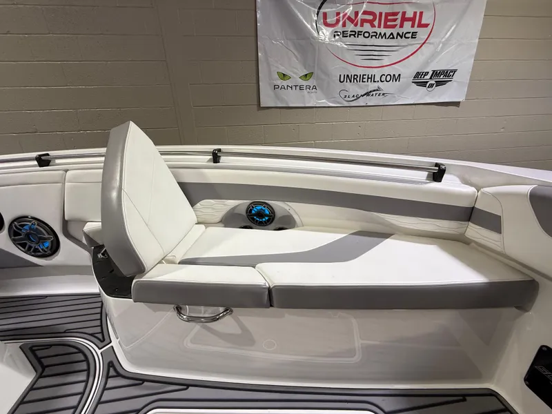 Slide: The Image of 2024 Sunsation 34 CCX boat interior with white seating and speakers. - 26