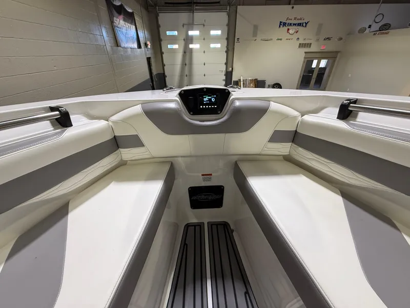 Slide: The Image of 2024 Sunsation 34 CCX boat interior with sleek seating and modern dashboard. - 27
