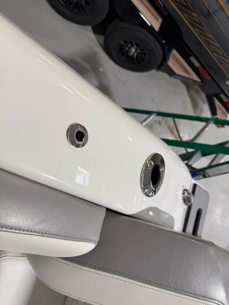 Slide: The Image of 2024 Sunsation 34 CCX boat interior with sleek white and gray seating. - 31