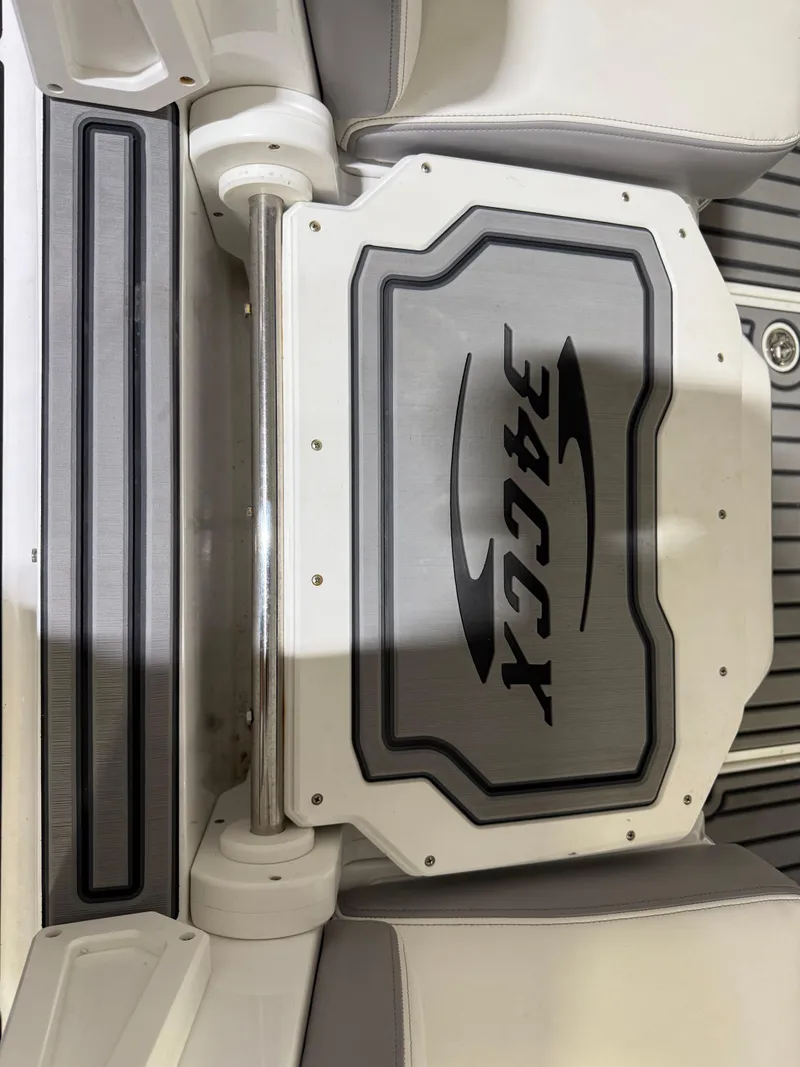 Slide: The Image of 2024 Sunsation 34 CCX boat seat detail with logo and sleek design. - 6