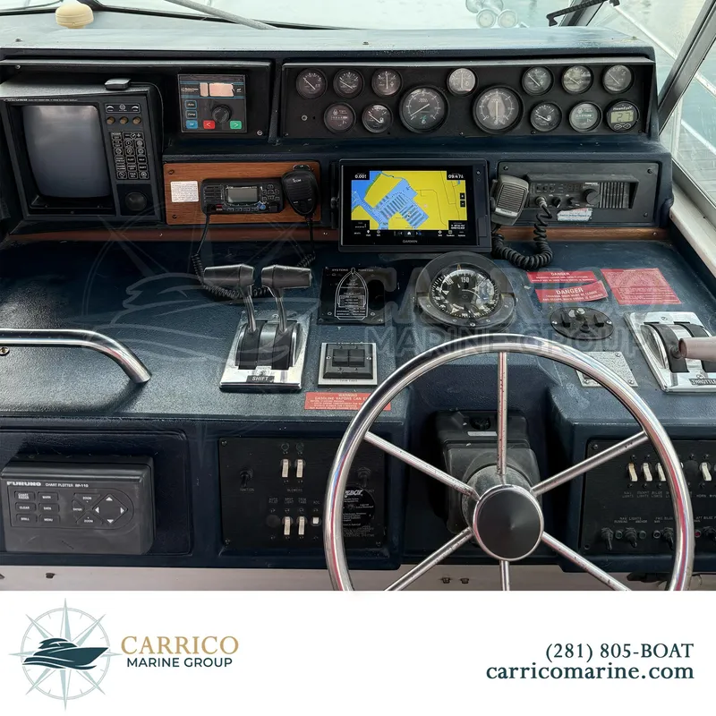 Slide: The Image of 1990 Sea Ray 390 Express Cruiser dashboard with navigation and control instruments. - 15