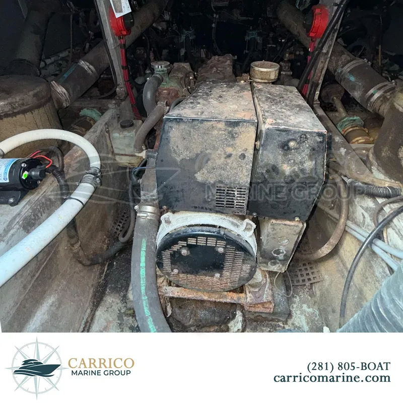 Slide: The Image of Engine compartment of a 1990 Sea Ray 390 Express Cruiser, showing machinery and hoses. - 36