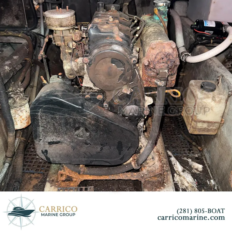 Slide: The Image of 1990 Sea Ray 390 Express Cruiser engine compartment with visible wear and rust. - 38