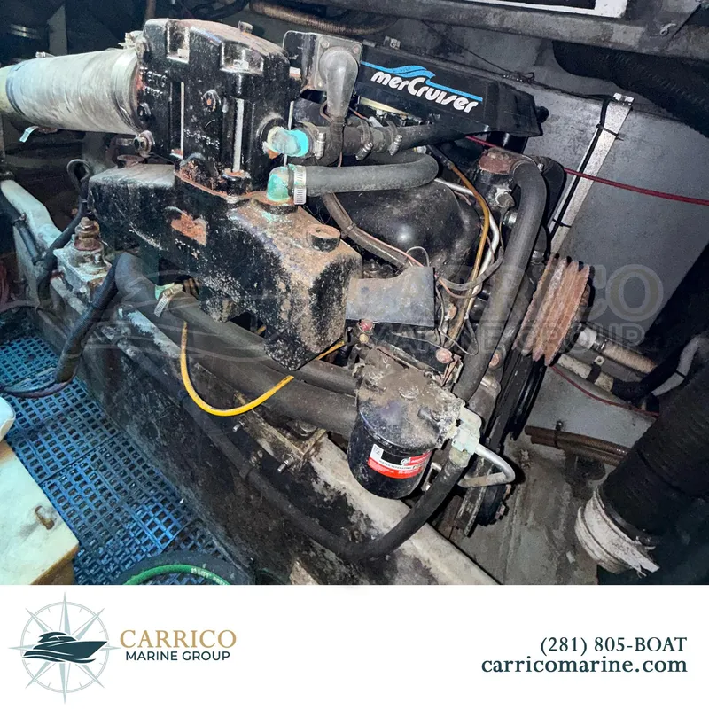 Slide: The Image of Engine compartment of a 1990 Sea Ray 390 Express Cruiser with MerCruiser components. - 40