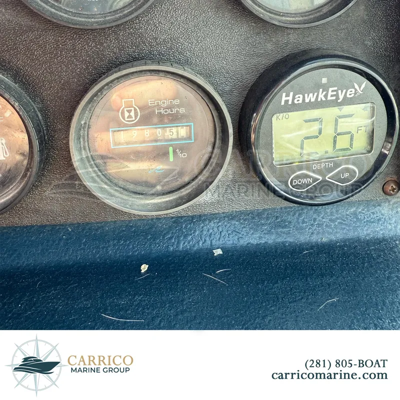 Slide: The Image of 1990 Sea Ray 390 Express Cruiser dashboard with engine hours and depth gauge. - 42