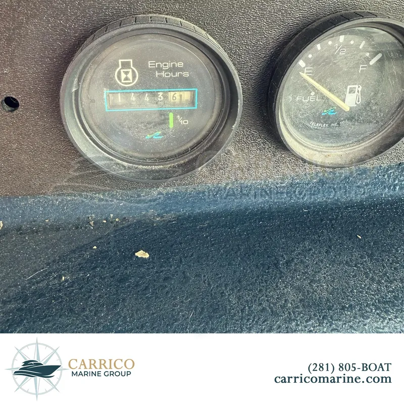 Slide: The Image of 1990 Sea Ray 390 Express Cruiser dashboard showing engine hours and fuel gauge. - 43