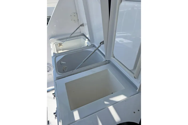 Slide: The Image of Open storage compartments on a 2000 Hatteras 60 Convertible yacht. - 15