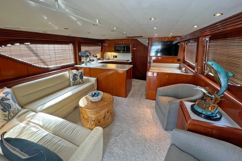 Slide: The Image of Luxurious interior of 2000 Hatteras 60 Convertible yacht with elegant furnishings and decor. - 16