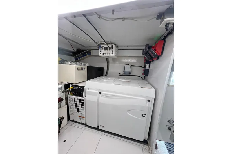 Slide: The Image of Engine room of 2000 Hatteras 60 Convertible yacht with Onan generator. - 42