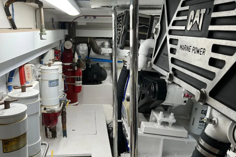 Slide: The Image of Engine room of 2000 Hatteras 60 Convertible with CAT marine power systems. - 44