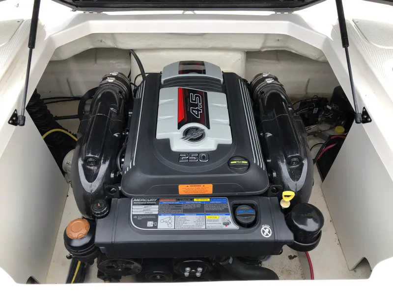 Slide: The Image of 2021 Chaparral 23 SSi boat engine compartment with Mercury 4.5L 250 HP engine. - 12