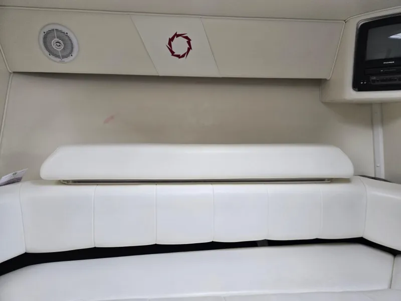 Slide: The Image of Interior of 2004 Fountain 47 Lightning boat with white seating and built-in speaker. - 11