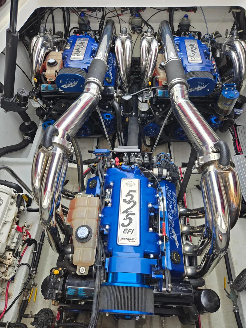 Slide: The Image of Twin Mercury 525 EFI engines in a 2004 Fountain 47 Lightning boat. - 6