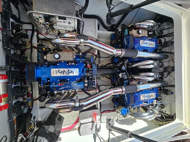 Slide: The Image of Engine compartment of a 2004 Fountain 47 Lightning boat with dual Mercury engines. - 7