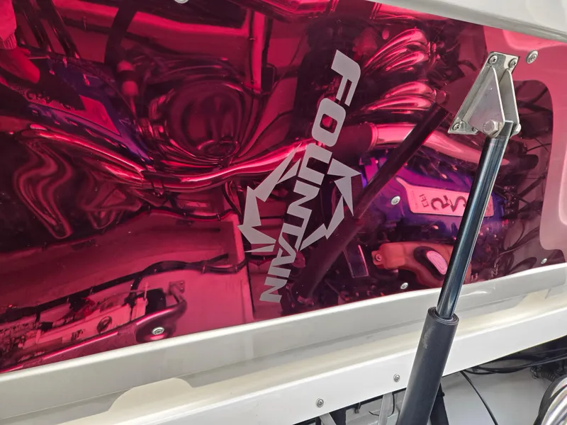 Slide: The Image of 2004 Fountain 47 Lightning boat engine with reflective red cover and logo. - 9