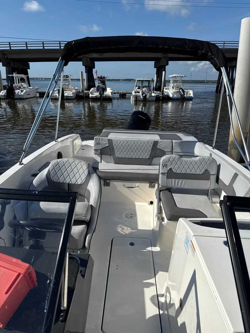 Slide: The Image of 2022 Bayliner VR6 Bowrider OB docked, featuring spacious seating and sleek design. - 3