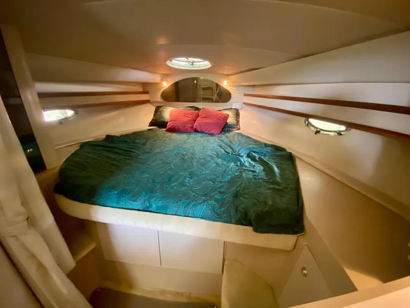 Slide: The Image of 1999 Cruisers Yachts 3375 Esprit cabin with cozy bed and ambient lighting. - 24